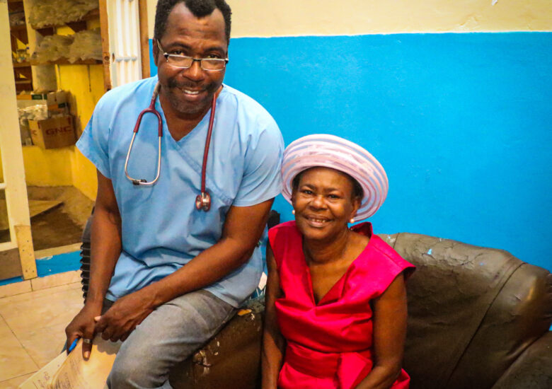 Dr. Manno and his patient at his clinic Sante 2000 in Haut Limbe, Haiti.